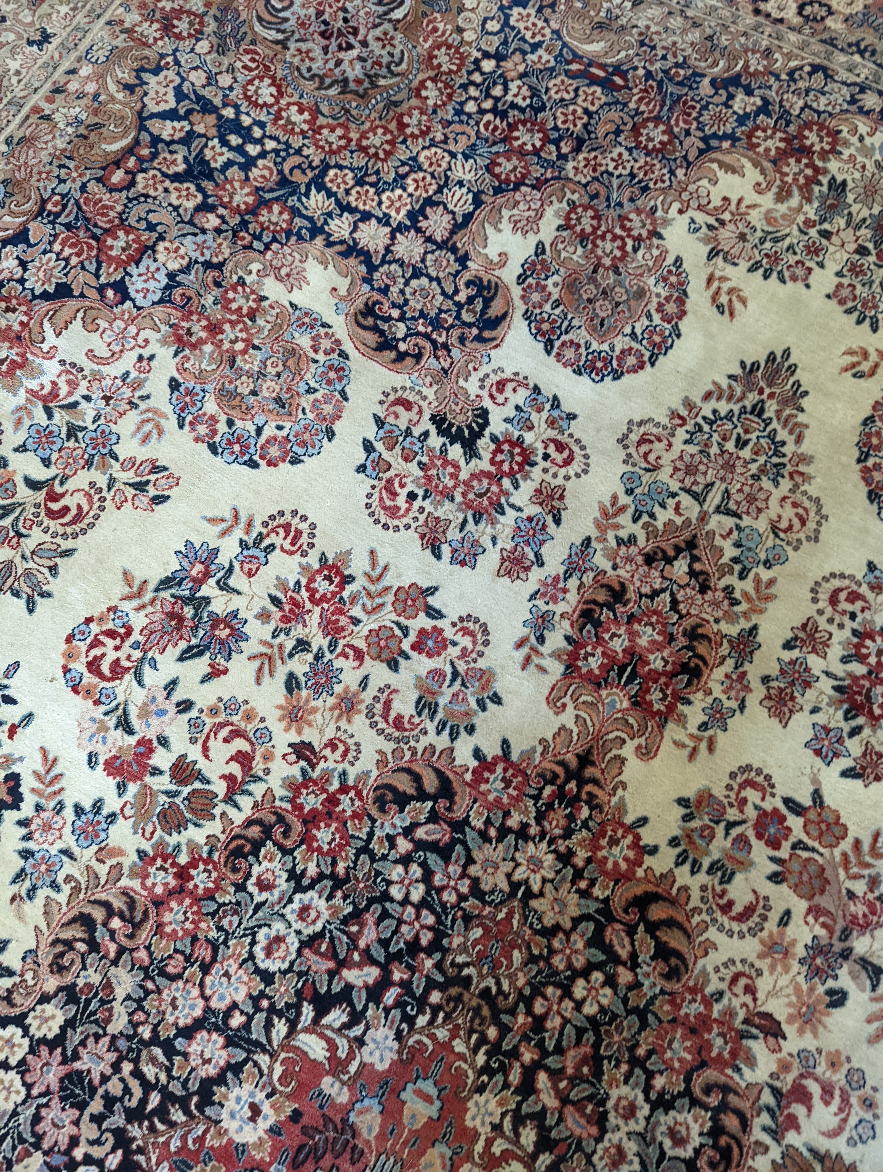 A North West Persian ivory ground carpet, 410 x 310cm